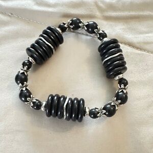 Black Onyx and silver tone stretchy bracelet. Rounds and discs